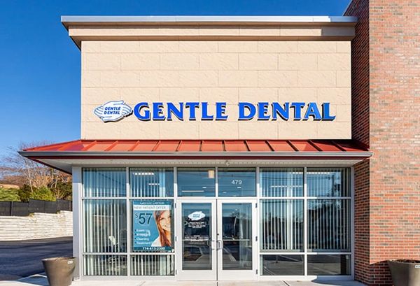 Exterior of Gentle Dental clinic with clear signage and glass entrance.