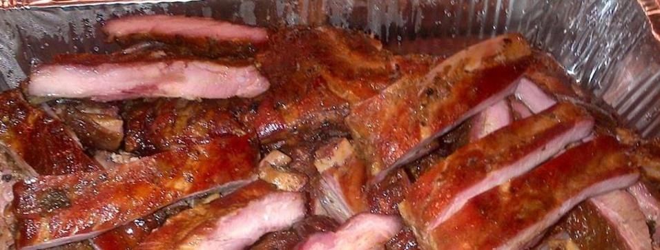 Rib tips from Archibald and Woodrow's BBQ, showing succulent, smoky meat with a pink smoke ring