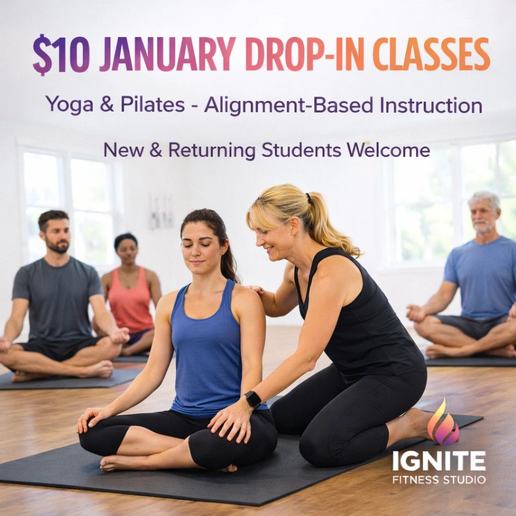 Stack of books next to pencils in a holder and a camera.