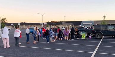 People in line to receive donated pet food at a Holly Hill distribution event.