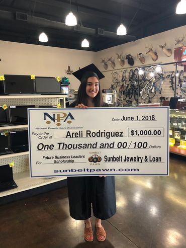 scholarship recipient accepting their scholarship check