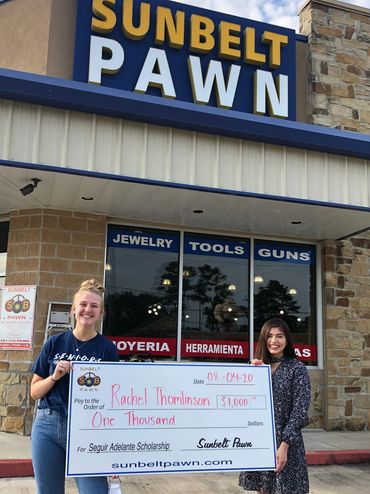 scholarship recipient accepting their scholarship check