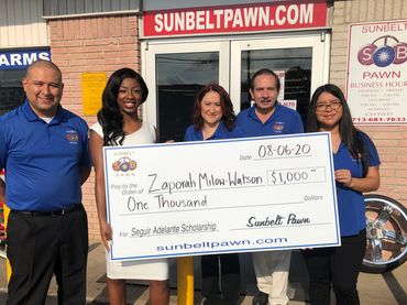 scholarship recipient accepting their scholarship check