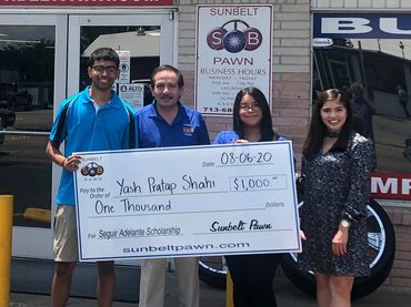 scholarship recipient accepting their scholarship check