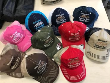 Hats are an annual perk of the Tobacco Root Classic Golf Tournament held in Three Forks every year.