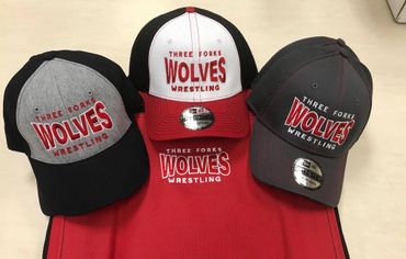 Wolves Wrestling Logo on caps and a stadium chair.