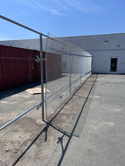 Using come-alongs to stretch 8' chain-link fence
