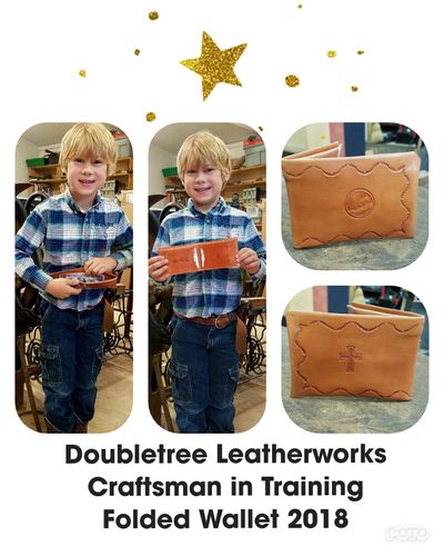 The youngest leather crafter in our shop holding a folded wallet he made!