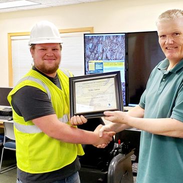Tyler, a 2022 graduate of Train Skills Management's 3-5 week training receives his Certificate