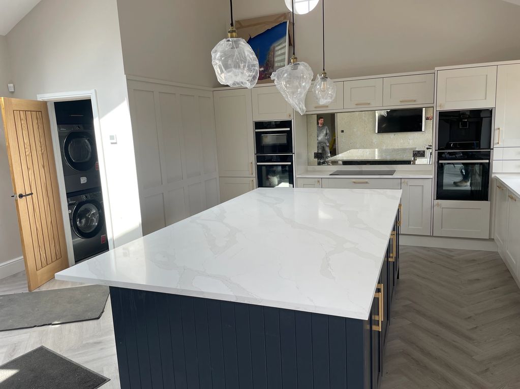 A perfect example of our stock Calacatta gold in 30mm and in the distance 6mm antique silver mirror