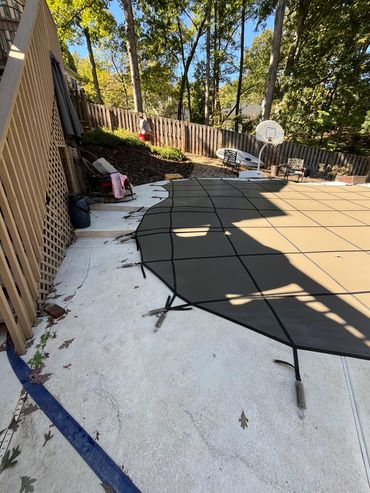 pool cover on a deck with steps