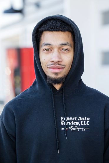 Expert Auto Service team member ready to assist with DMV paperwork, VIN verifications, and customer