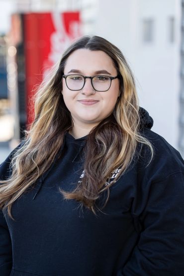 Expert Auto Service team member providing friendly DMV registration assistance and customer support