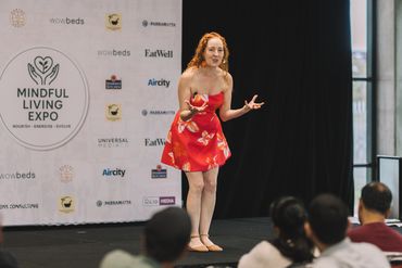 Leanne Zaccar on Stage at Mindful Living Expo passionately delivering her Keynote