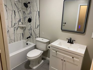 Bathroom created in a large bedroom.