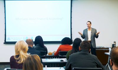 A man giving a presentation to an audience.
