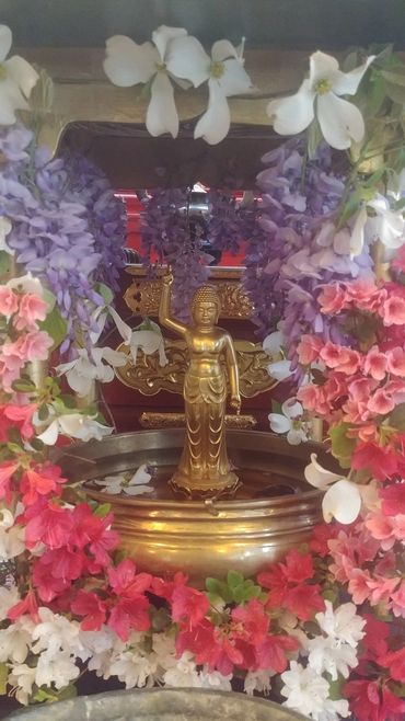 The Birth Buddha Statue is decorated for the Flower Festival.