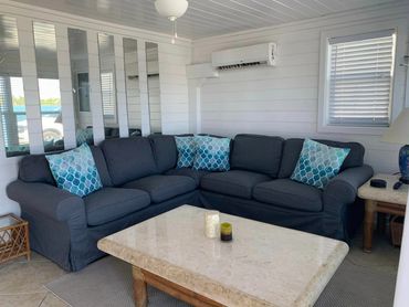 A large couch in a clean living room.