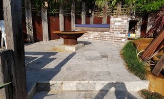 travertine tiles on concrete recycled brick