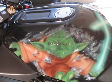 Airbrushed Yoda on a motorcycle tank.
