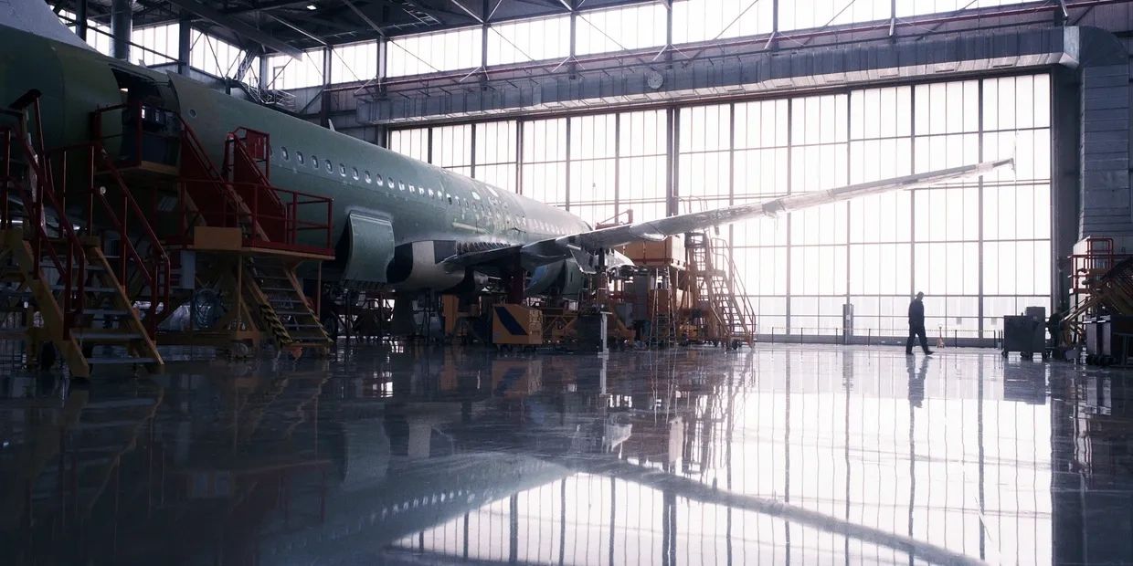 Large aircraft inside hangar bay.
