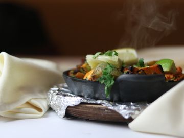 A hot pan with Tandoori Veggies Grill
