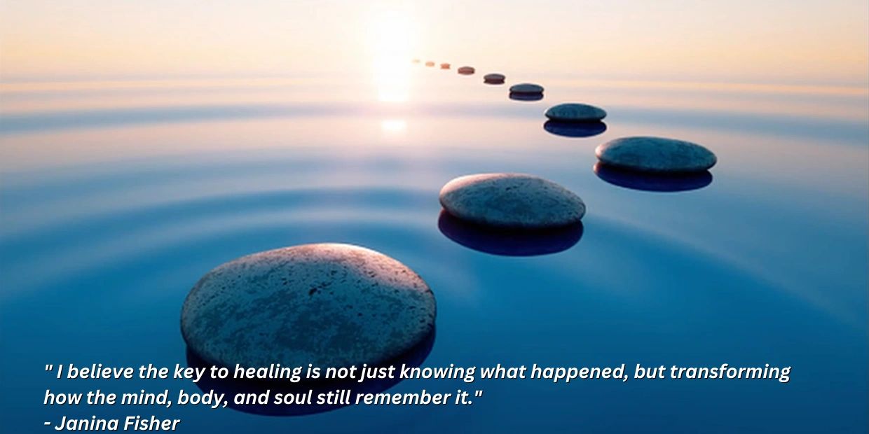 Smooth stones forming a path over calm water at sunset, symbolizing healing and transformation.