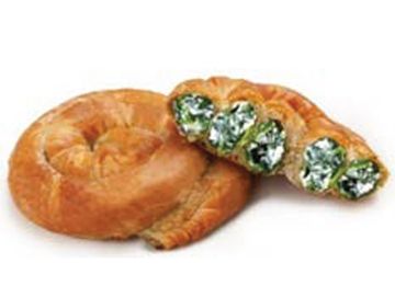 Spiral pastry filled with a green filling.
