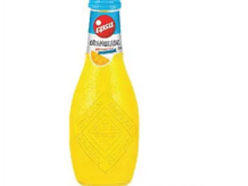 A bottle of orange flavored Fanta soda.