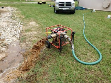 Water storage tank being cleaned by divers while the tank remains in service with minimal water loss.