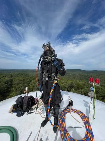 Water Tower Diving Specialist on top of water tower.