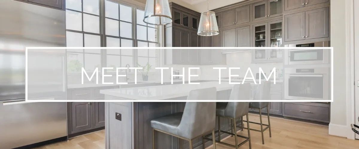 meet the team, high end island kitchen with large windows and grey cabinets
