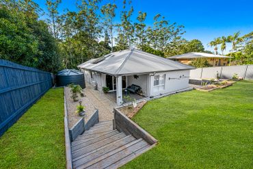 Modern house with a well-maintained backyard and garden.