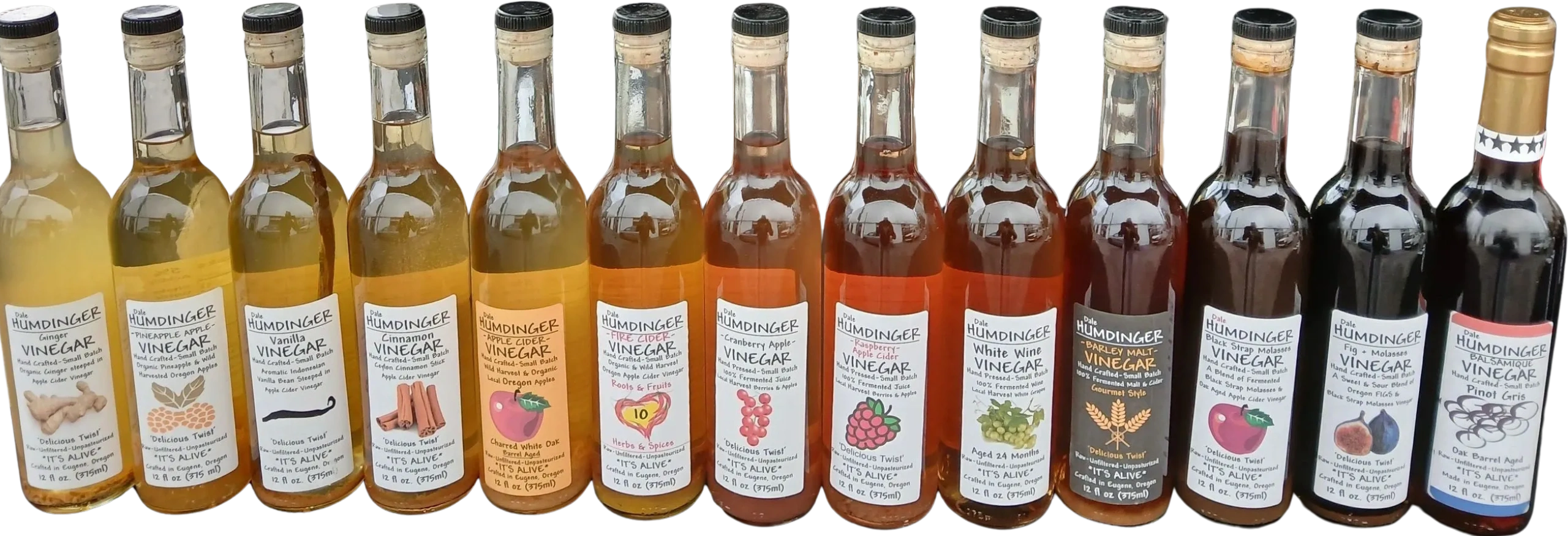 A lineup of various Dale Humdinger vinegar bottles with different flavors and labels.