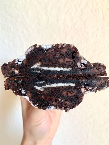 Chocolate base cookie with semi-sweet and white chocolate chips, Oreo pieces, stuffed with an Oreo