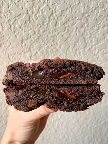 Soft baked chocolate based cookie with dark chocolate chips and gooey chocolate center
