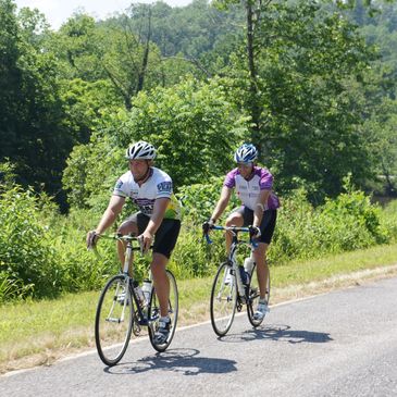 Two bicyclists cycling on marked bicycle routes