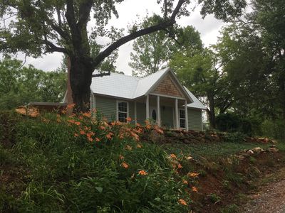 Front of The Dock Barnard Farm cottage accented by orange daylilies