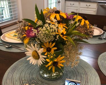 Wildflower bouquet on the dining table at The Dock Barnard Farm