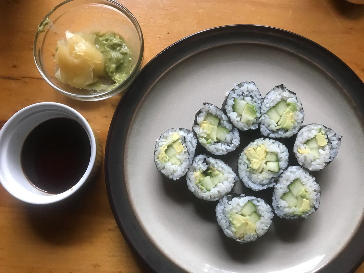 Handmade sushi with organic wasabi and soy sauce on the side.