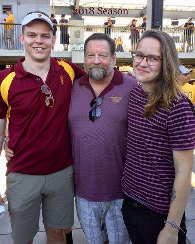 Father, son and daughter at Sun Devil Stadium.