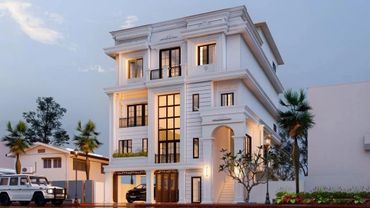 Elegant white three-story house with warm lighting and modern design.
