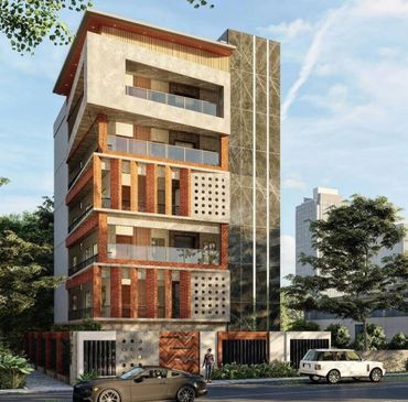 Modern multi-story residential building with cars parked outside on a sunny day.