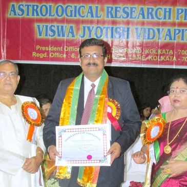 Dr. Subrata Chatterjee receiving Ph.D. certificate from Viswa Jyotish Vidyapith—an honor earned.