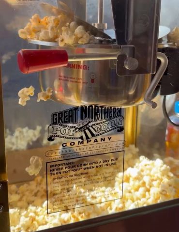 Popcorn popping inside a Great Northern Popcorn Company machine.