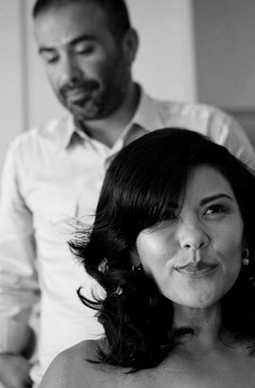 Black and white portrait of a woman and man, woman in focus.