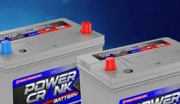 Two Power Crank car batteries on a futuristic grid background.