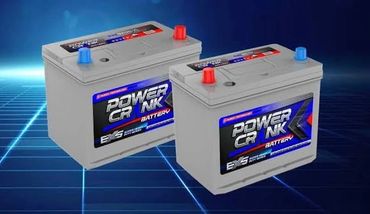Two Power Crank car batteries on a futuristic grid background.