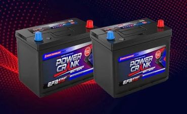 Two black car batteries with blue and red terminals labeled Power Crank.