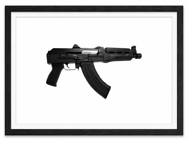 Framed image of a black AK-47 assault rifle on white background.